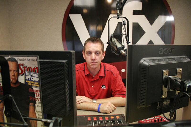 Eric Frandsen, an account executive for the Cache Valley Radio Group, sits at one of the group's stations Wednesday. The company owns seven of the nine commercial radio stations in Cache Valley.