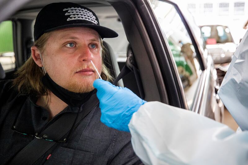Corey Clark receives a COVID-19 nasal swab test at the Utah State Fairpark. The novel coronavirus hasn’t gone away just yet. In fact, it’s still very much out there.