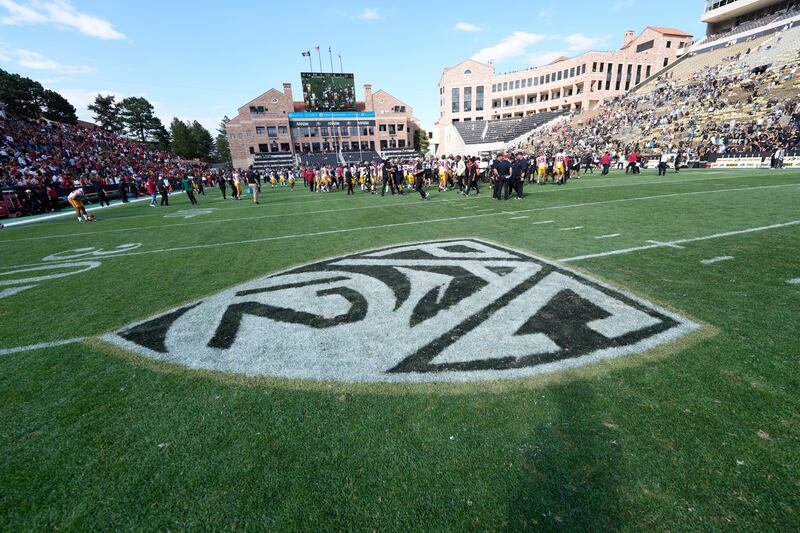 Pac-12 logo on the surface of Folsom Field in the second half of an NCAA college football game.