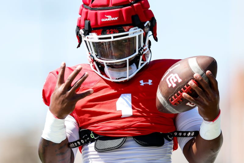 Utah freshman running back Jaylon Glover gets in some work during fall camp at the University of Utah in Salt Lake City.