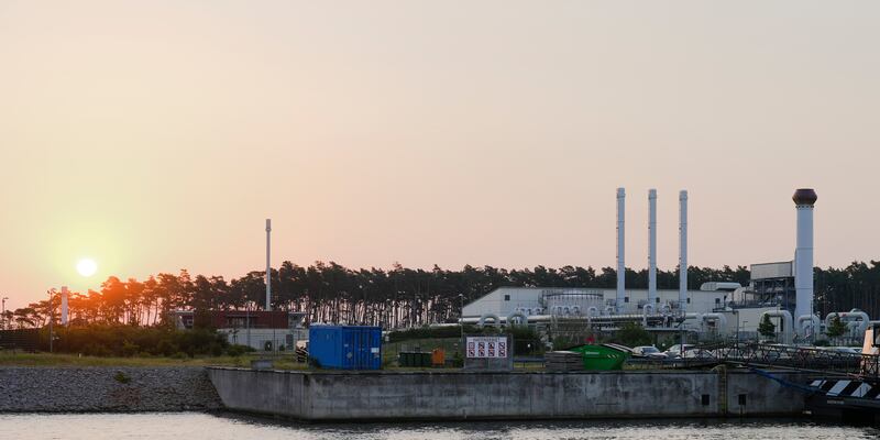 The sun rises behind the landfall facility of the Nord Stream 1 Baltic Sea pipeline and the transfer station of the OPAL gas pipeline, the Baltic Sea Pipeline Link, in Lubmin, Germany.