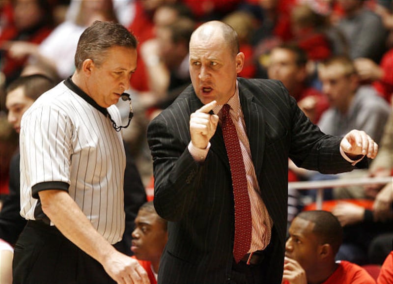 Utah head coach Jim Boylen contests a call as the Utes and BYU Cougars play in MWC men's basketball Wednesday at the Huntsman Center in Salt Lake City. BYU won 71-51.