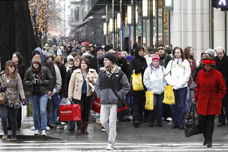 In December, shoppers jam the streets to find holiday deals in Chicago. Household net worth rose last quarter.