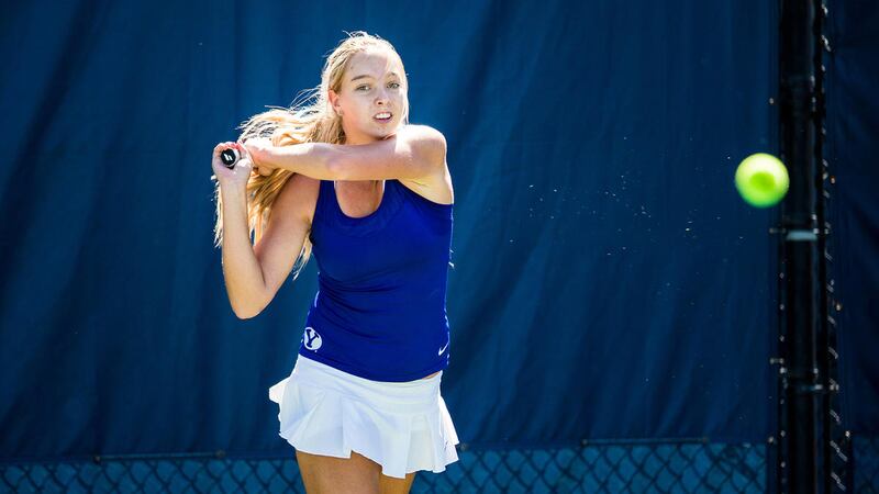 Freshman Anastasia Abramyan hits the ball. She only dropped one game the entire match for a decisive 6-0, 6-1 victory on Friday.