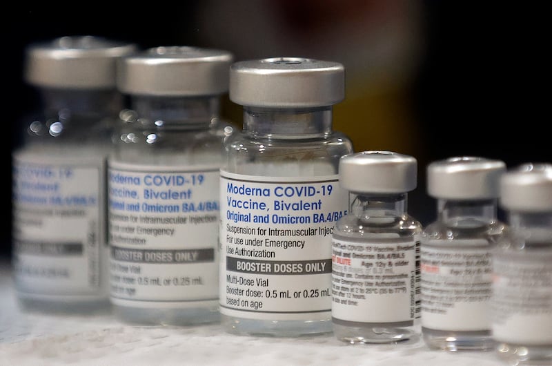 Vials of the Moderna and Pfizer COVID-19 bivalent booster are pictured at a vaccine clinic in Taylorsville on Nov. 9, 2022.