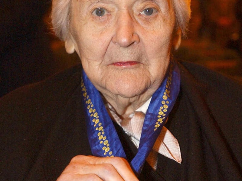 FILE - In this March 2, 2004 file photo, Australian spy and French resistance hero Nancy Wake displays her medal after she was made a Companion of the Order of Australia in London. Wake has died in London at age 98 on Sunday, Aug. 7, 2011.