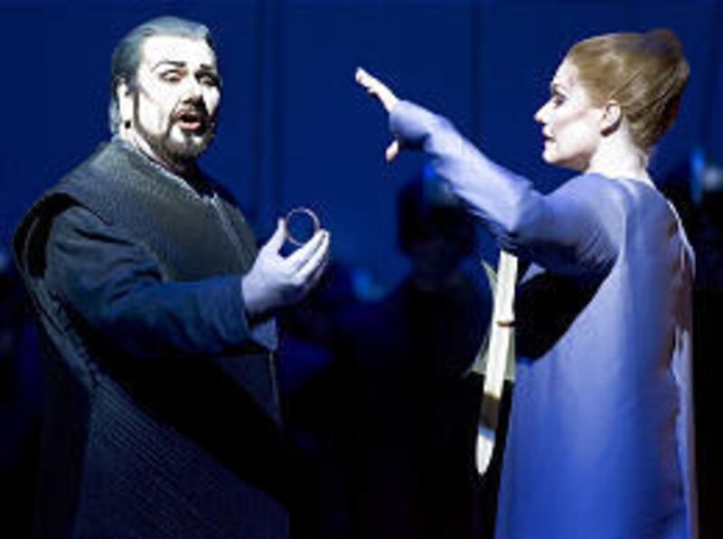 Soprano Karita Mattila (Elsa) reacts as tenor Ben Heppner (Lohengrin) holds a bracelet during a scene from the Metropolitan Opera's production of Richard Wagner's "Lohengrin" in New York City.