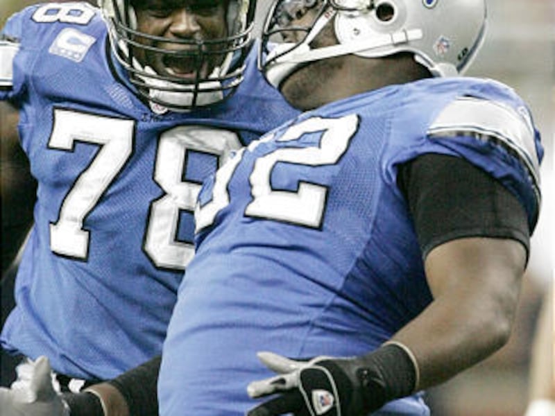 Detroit Lions defensive tackle Shaun Rogers, right, celebrates with Corey Redding last Sunday. The Lions are surprisingly celebrating quite a bit so far in their 6-2 season.