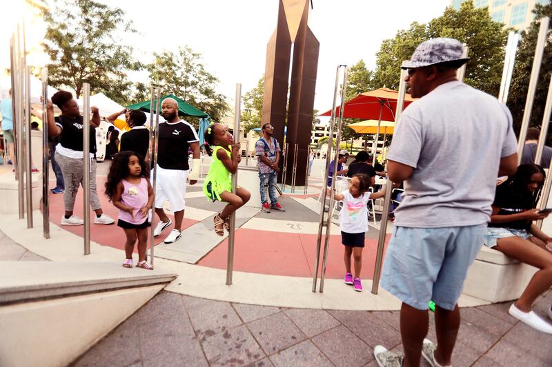 Anthony Matthews talks with his granddaughter Jaelyn Sawyer and daughter Heaven Marie Matthews as they attend a Juneteenth festival at the Gallivan Center in Salt Lake City on Wednesday, June 19, 2019. As Utah's population becomes increasingly diverse, th