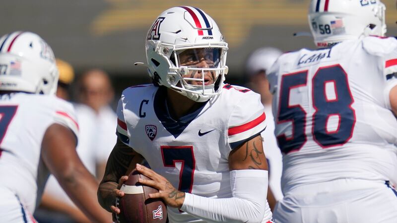 Arizona quarterback Jayden de Laura (7) looks to pass against California in a college football game in Berkeley, Calif., Saturday, Sept. 24, 2022.