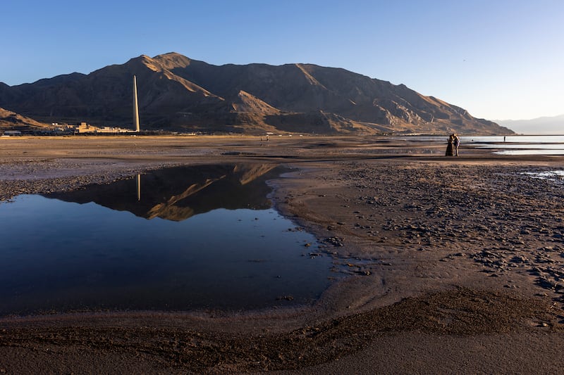 Izabel and Mary LePique take photos at the Great Salt Lake in Salt Lake City.