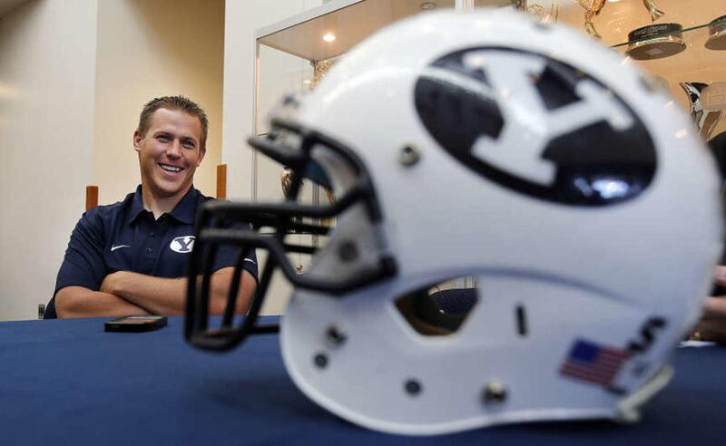 Defensive coordinator Nick Howell is interviewed during BYU Football Media Day in Provo, Monday, June 23, 2014.
