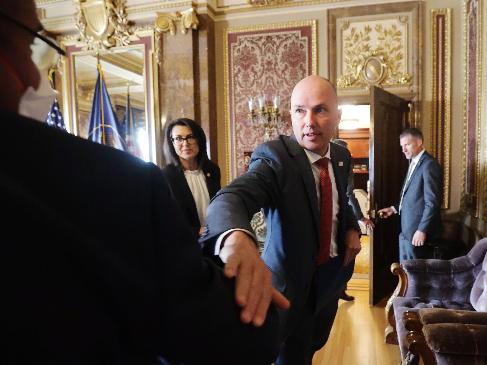 Gov. Spencer Cox elbow-bumps Marc Harrison, CEO of Intermountain Healthcare, after a COVID-19 briefing in Salt Lake City.