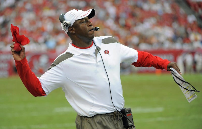 Tampa Bay Buccaneers head coach Raheem Morris throws the challenge flag during the third quarter of an NFL football game against the Atlanta Falcons, Sunday, Sept. 25, 2011, in Tampa, Fla.