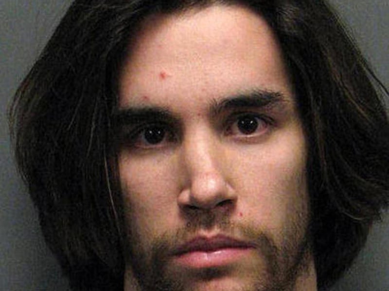 In this undated file photo provided by the Washoe County Sheriff's Office via the Reno Gazette Journal, Justin Massler, 27, is shown during his booking.