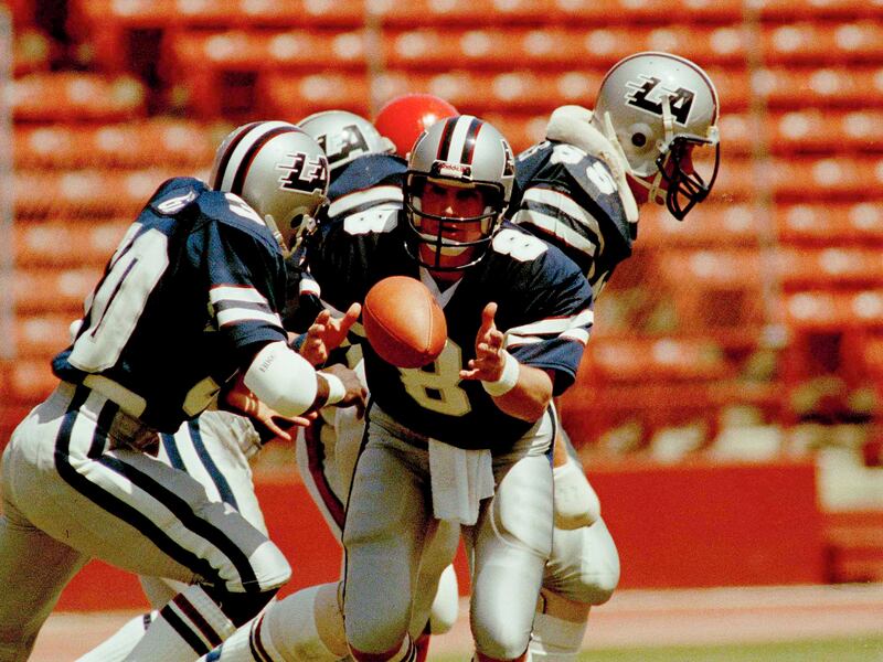 Quarterback Steve Young pitches the ball during his days playing in the USFL. The USFL, which lasted three years in the 1980s, is relaunching in 2022.