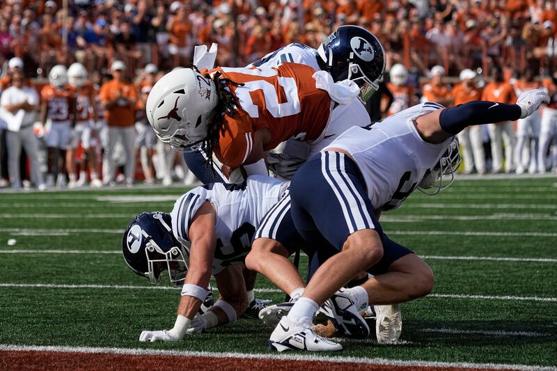 Texas running back Jonathon Brooks (24) lunges for a touchdown during the first half of an NCAA college football game against BYU in Austin, Texas, Saturday, Oct. 28, 2023.