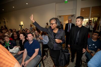 Anita Hill waves to the crowd as she enters the room prior to speaking at the Obert C. and Grace A. Tanner Humanities Center at the University of Utah in Salt Lake City on Wednesday, Sept. 26, 2018.