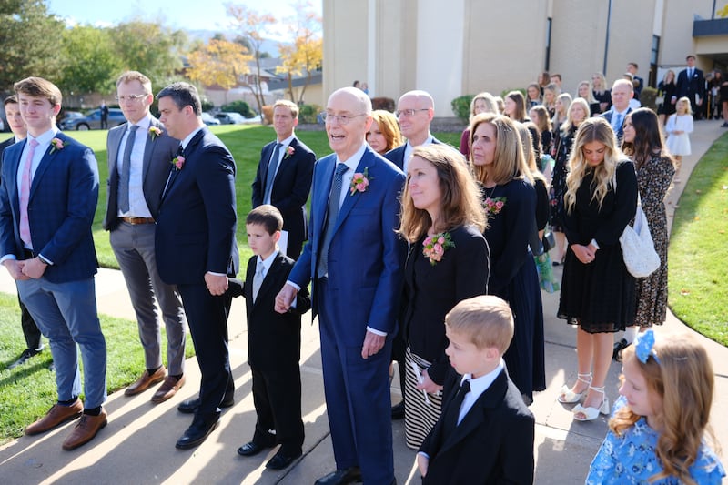 President Henry B. Eyring holds hands with a great-grandson after the funeral of his wife, Sister Kathleen Johnson Eyring.