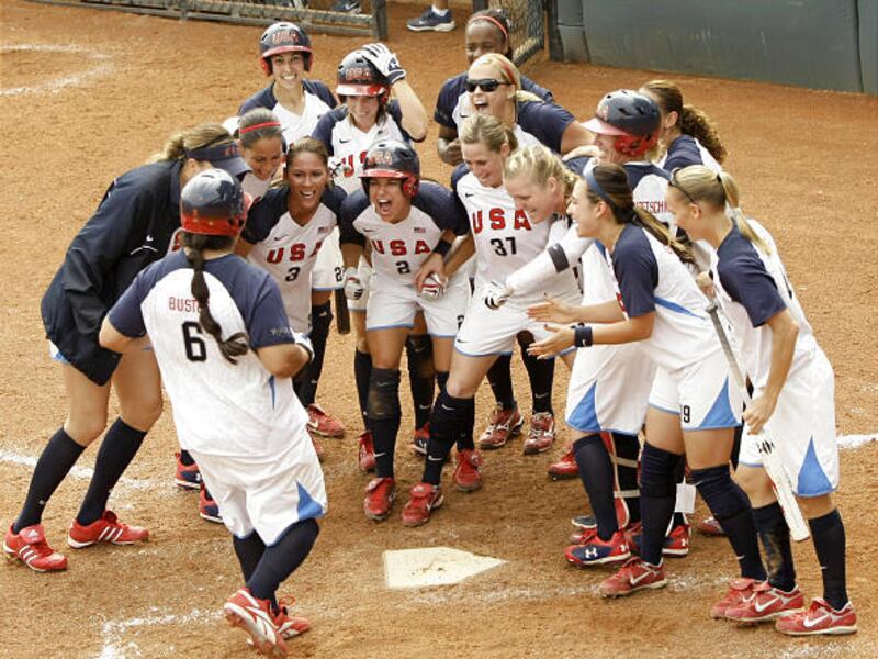 The US celebrates after a three-run home run by Crystl Bustos.