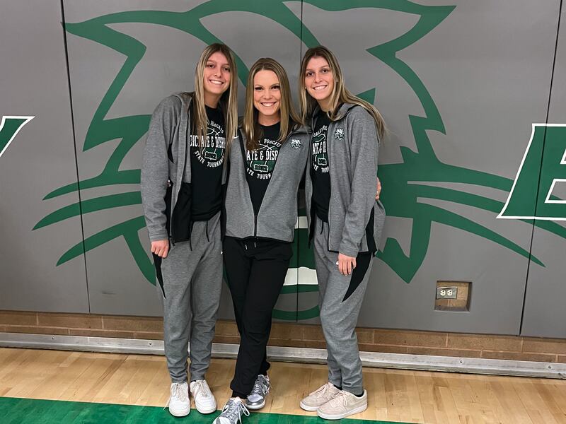 Newly named BYU women’s coach Amber Whiting, center, poses for a picture with two of her Burley High players.