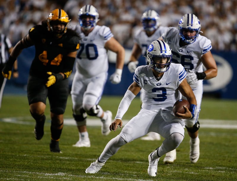 Brigham Young Cougars quarterback Jaren Hall (3) runs with the ball during a game against Arizona State.