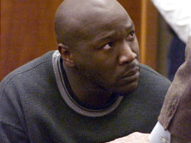 Christopher McCowen listens to his attorney in court Friday in Orleans, Mass.