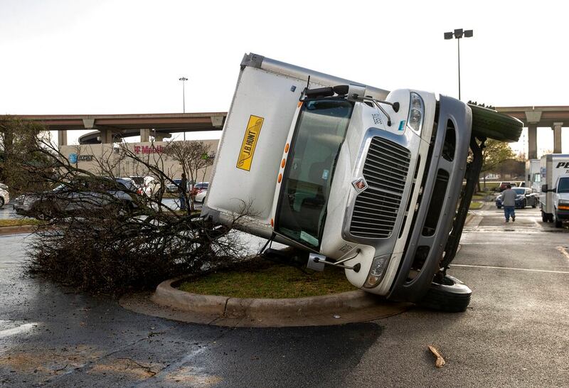 A truck is knocked on its side in Round Rock, Texas.