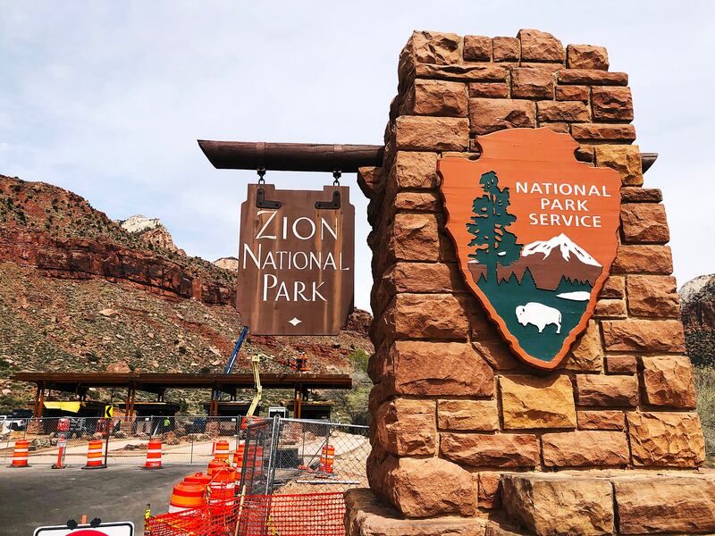 The entrance to Zion National Park is pictured on Wednesday, March 25, 2020. At back left, new entrance booths are under construction. The park was closed on Friday, April 3, 2020, to fight the coronavirus pandemic.