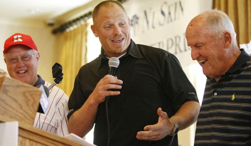 Former BYU and NFL football player Hans Olsen has fun with former head coaches LaVell Edwards, right.