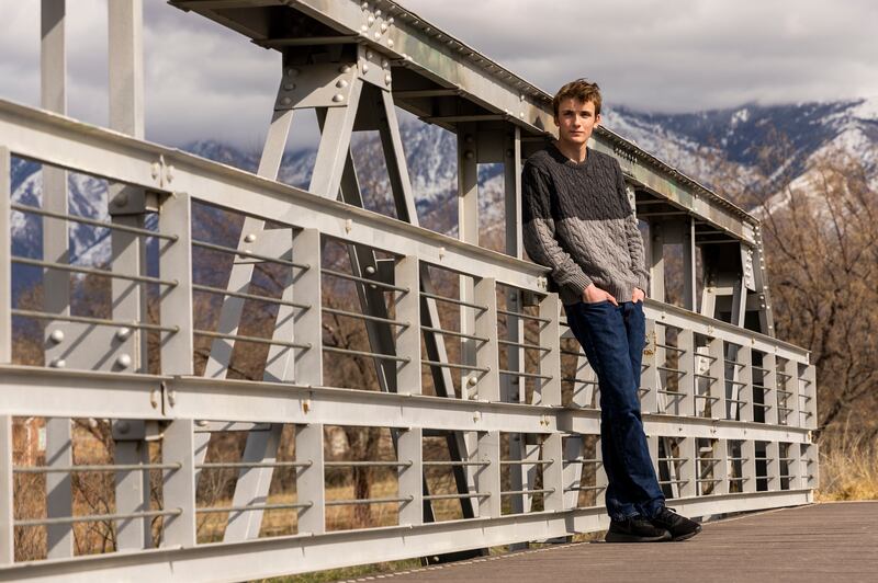 Dallin Rima, a 17-year-old senior at Hillcrest High School, poses for photos in Riverton, Utah.