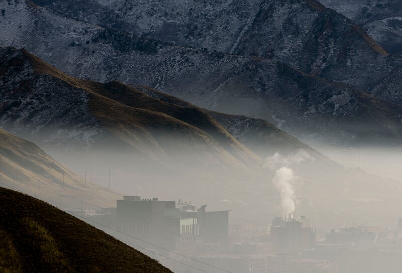 Fog and smog covers the Huntsman Cancer Institute and other buildings located on the benches of Salt Lake City on Dec. 18, 2023.
