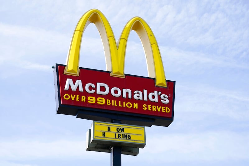 A sign is displayed outside a McDonald’s restaurant.