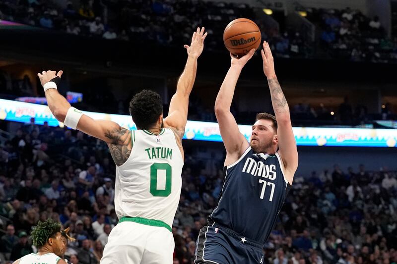 Dallas Mavericks guard Luka Doncic shoots against Boston Celtics forward Jayson Tatum in Dallas, Thursday, Jan. 5, 2023.