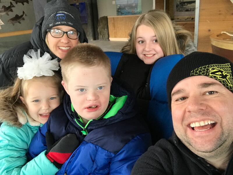 Emily and Cody Craynor pose for a selfie with their kids, Caylee, 6, Mikey, 16, and McKenzie, 12.