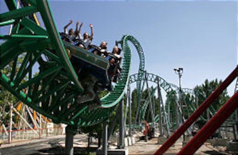 Riders on Wicked \— Lagoon's newest roller coaster that opened June 1 \— shriek as they race around the track.