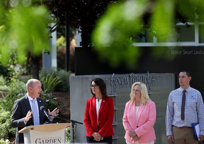 Gov. Spencer Cox speaks about water conservation as Lt. Gov. Deidre Henderson, South Jordan Mayor Dawn Ramsey and Central Utah Water Conservation District manager Rick Maloy participate in a press conference.