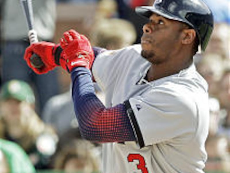 USA's Ken Griffey Jr. hits an RBI single against South Africa on Friday. He had four hits and seven RBIs in the World Baseball Classic game.
