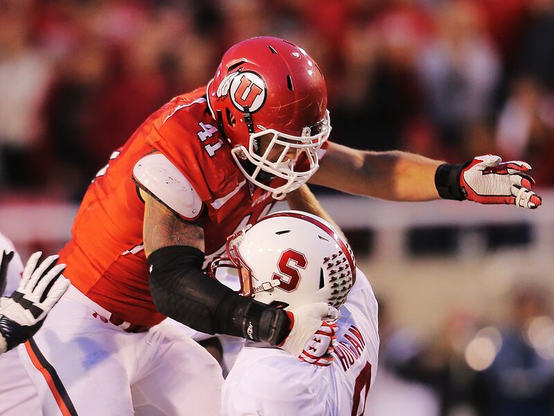 Utah’s Jared Norris tackles Stanford quarterback Kevin Hogan.