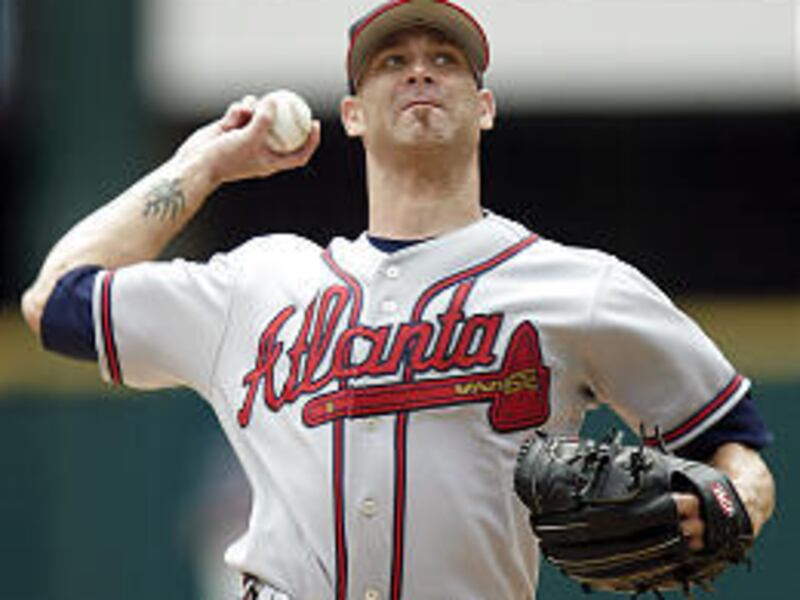 Atlanta's Tim Hudson used a long-lost split-finger fastball on Saturday to earn his 100th career victory.
