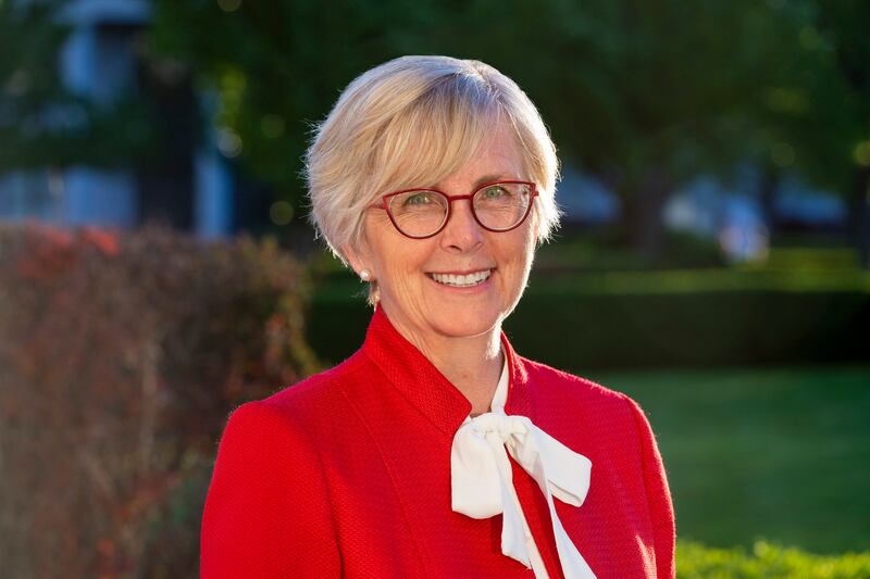 Former state lawmaker Becky Edwards is pictured in a red shirt with a white ribbon.