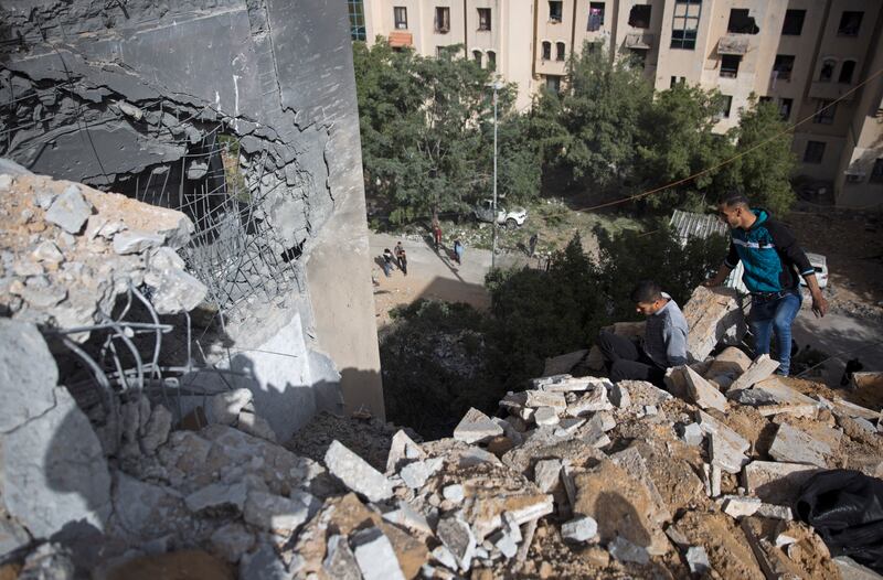Palestinians inspect the damage of a destroyed house following a late night Israeli missile strike in town of Beit Lahiya, Northern Gaza Strip, Monday, May 6, 2019. The Israeli military has lifted protective restrictions on residents in southern Israel wh