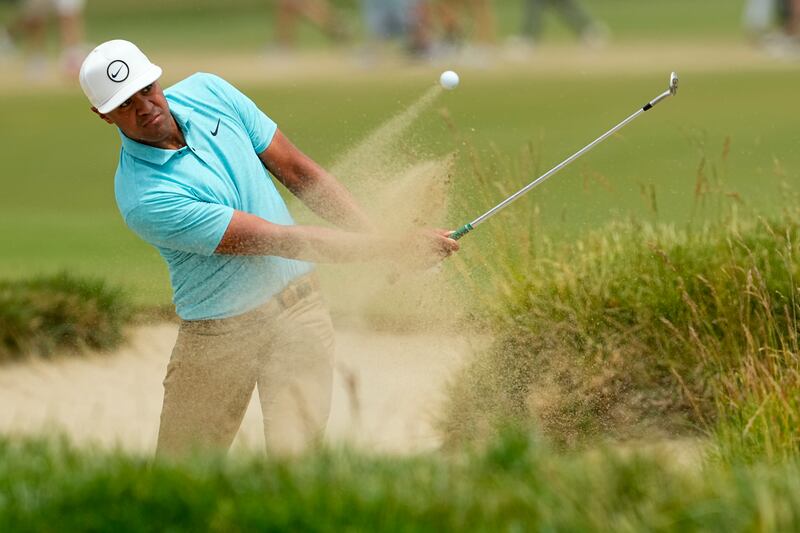 Tony Finau hits from the bunker on the 18th hole during the second round of the U.S. Open.