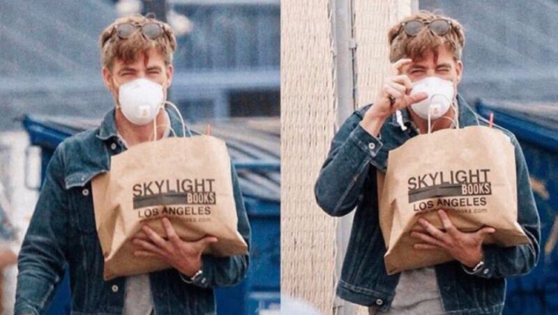 Rachael Conrad shared a photo of Chris Pine on social media Monday. The photo shows Pine wearing a face mask with a bag from Skylight Books in Los Angeles/