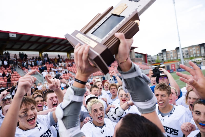Corner Canyon celebrates after winning the 6A boys lacrosse championships at Zions Bank Stadium in Herriman on May 26, 2023.