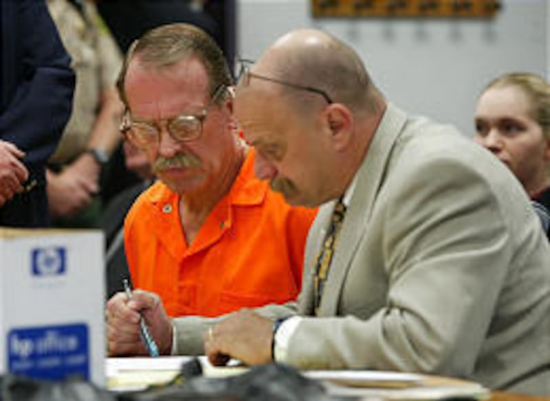 FILE - Ron Yengich, right, works with his client Ron Lafferty in 4th District Court in Provo on Sept. 25, 2002.