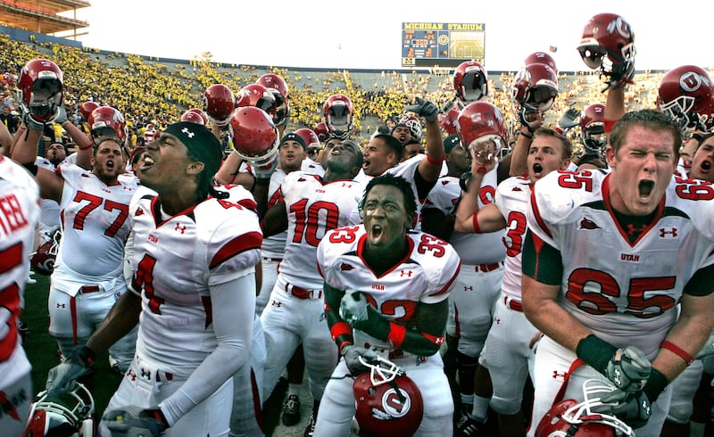 Utah celebrates its win over the University of Michigan in the season opener in Ann Arbor, Michigan, on Aug. 30, 2008.