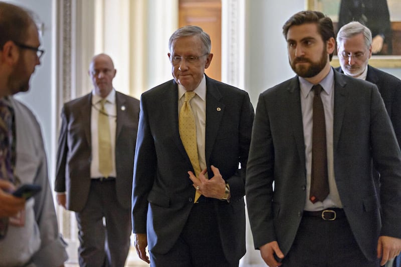 Senate Majority Leader Harry Reid of Nev., leaves the Senate floor on Capitol in Washington, in this Wednesday, March 5, 2014 file photo, after President Barack Obama's choice to head the Justice Department's civil rights division failed a Senate test vot