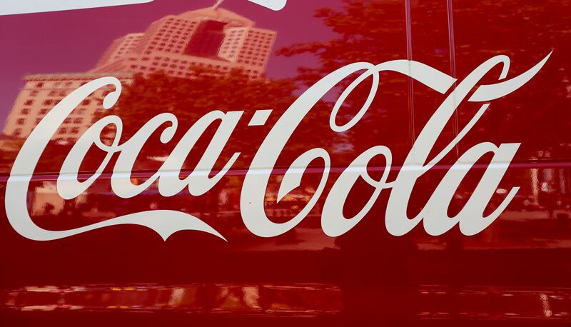 FILE - This April 24, 2017, photo shows a Coca-Cola delivery van in downtown Pittsburgh. Coca-Cola is reporting strong profit and revenue numbers, thanks in part to rising demand for Diet Coke and Coca-Cola Zero Sugar in North America. The Atlanta company