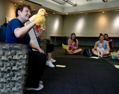 Sherrie Mortensen, associate children’s librarian at the Anderson-Foothill Library in Salt Lake City, uses a duck puppet as she sings a song during storytime on Wednesday, June 19, 2019.
